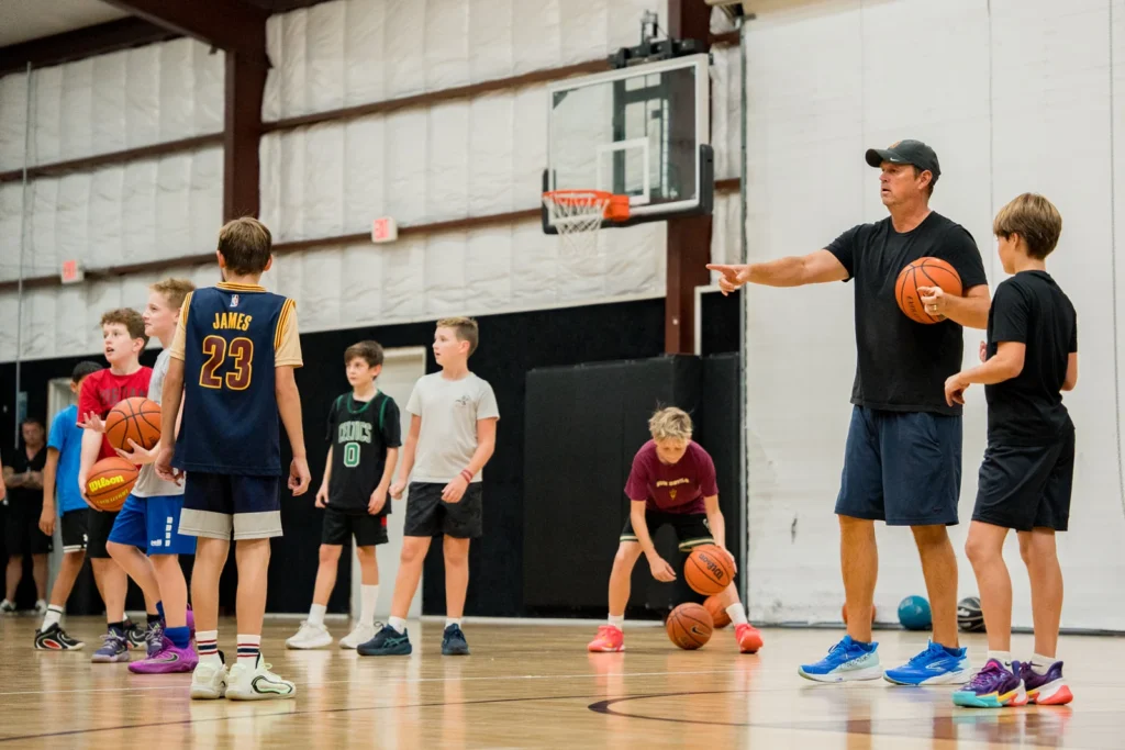 DS Storm coach instructing young players at a clinic
